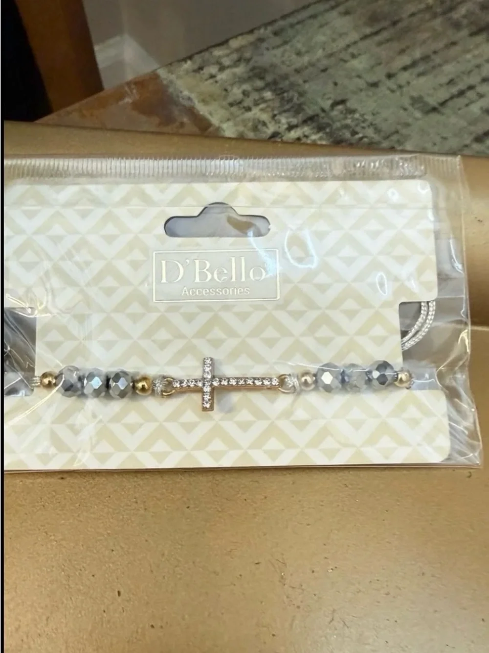 New D'Bello simulated  diamond, gold toned cross with beads bracelet.  Light gra